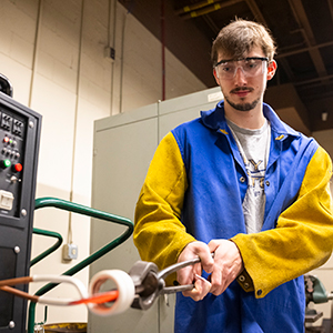 Mitch Timerman heats up his steel in the college&rsquo;s new induction forge.