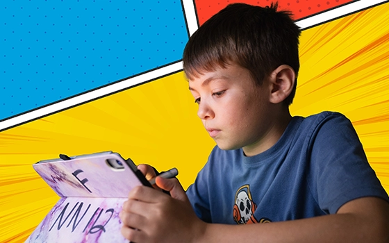 A camper draws on an iPad with a colorful comic book-style background.