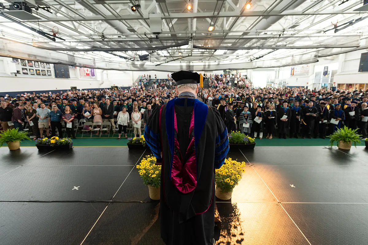 Stage view of President Szafran speaking to the class of 2022.
