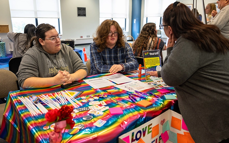 Two students attend the Be Yourself table at Fresh Check Day.