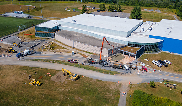 Crews update the front entrances of Roos House.